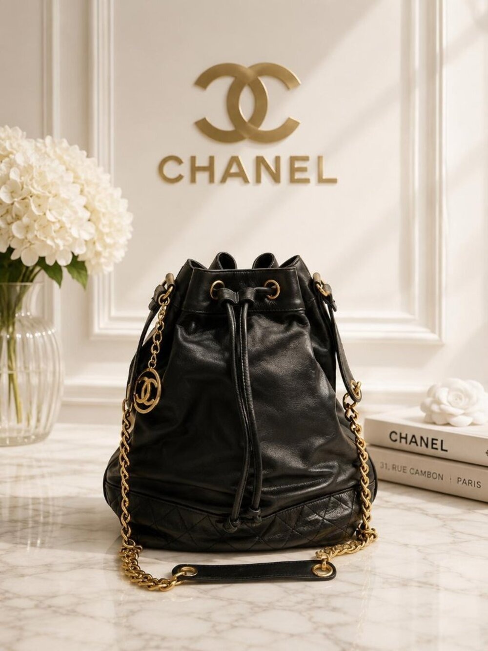 Authentic Chanel Drawstring Bucket Bag Black Leather Gold Chain CC Logo